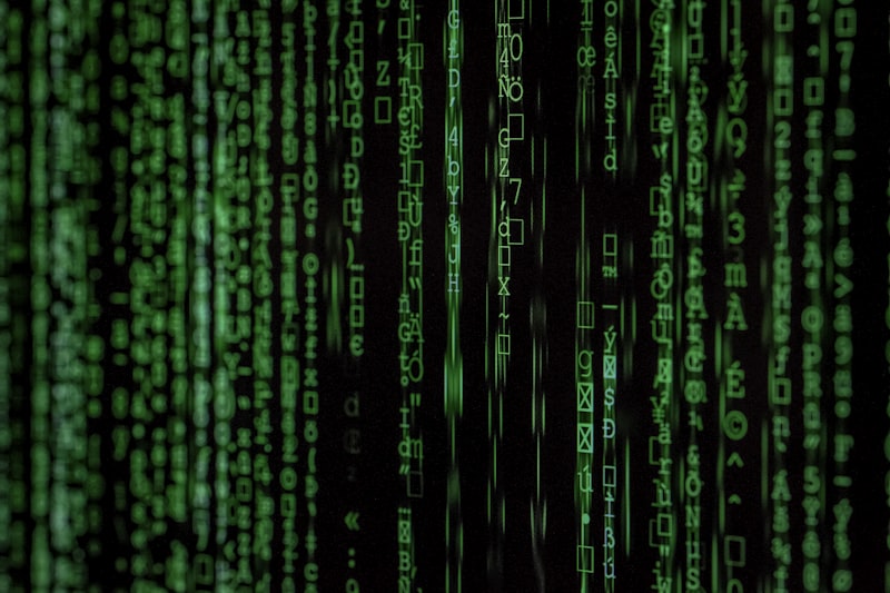 Binary code projection on a dark surface, futuristic data stream in deep sapphire blue, no people